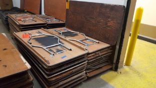 Lot of (20) assorted 6 foot by 30 inch folding leg wood tables on a pallet