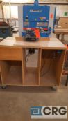 Custom-made portable router table with Porter-Cable router and Delta Versa feeder