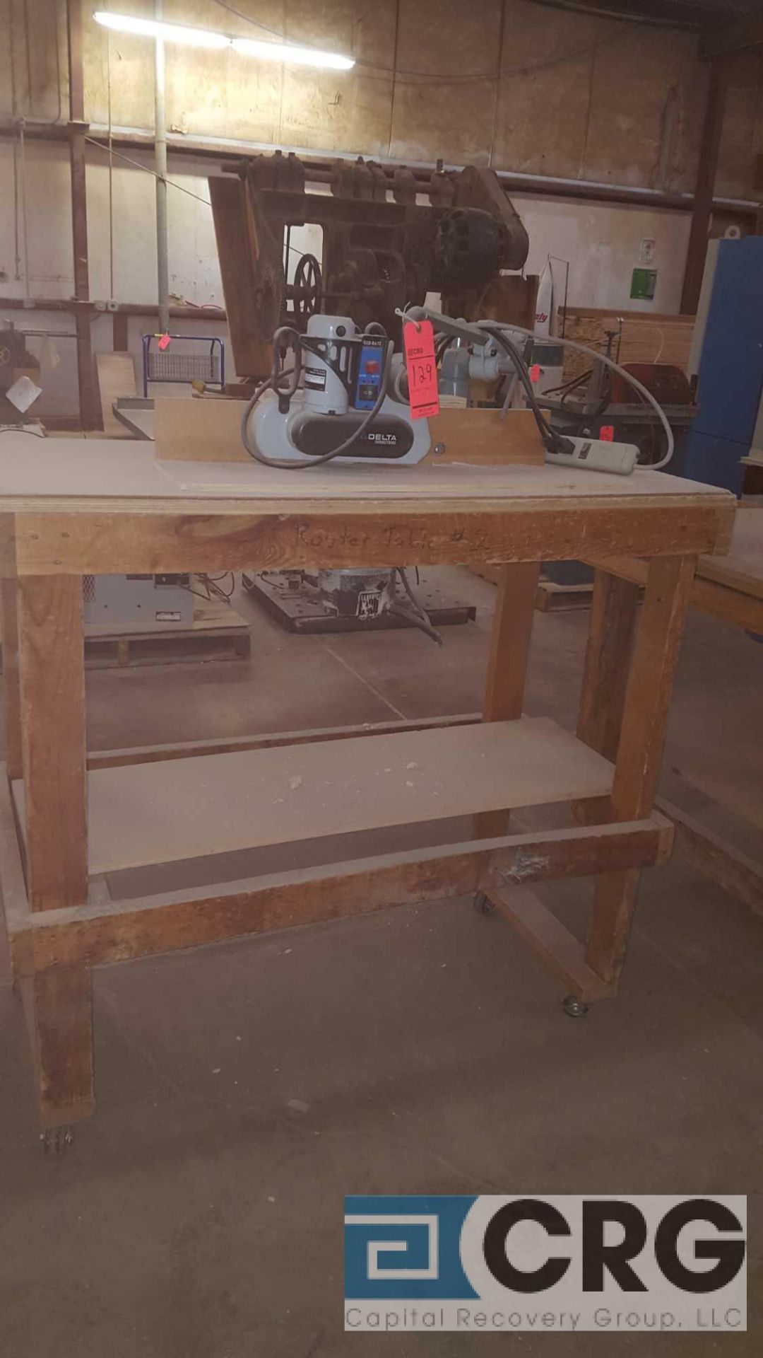Custom-made portable router table with Porter-Cable router and Delta feeder