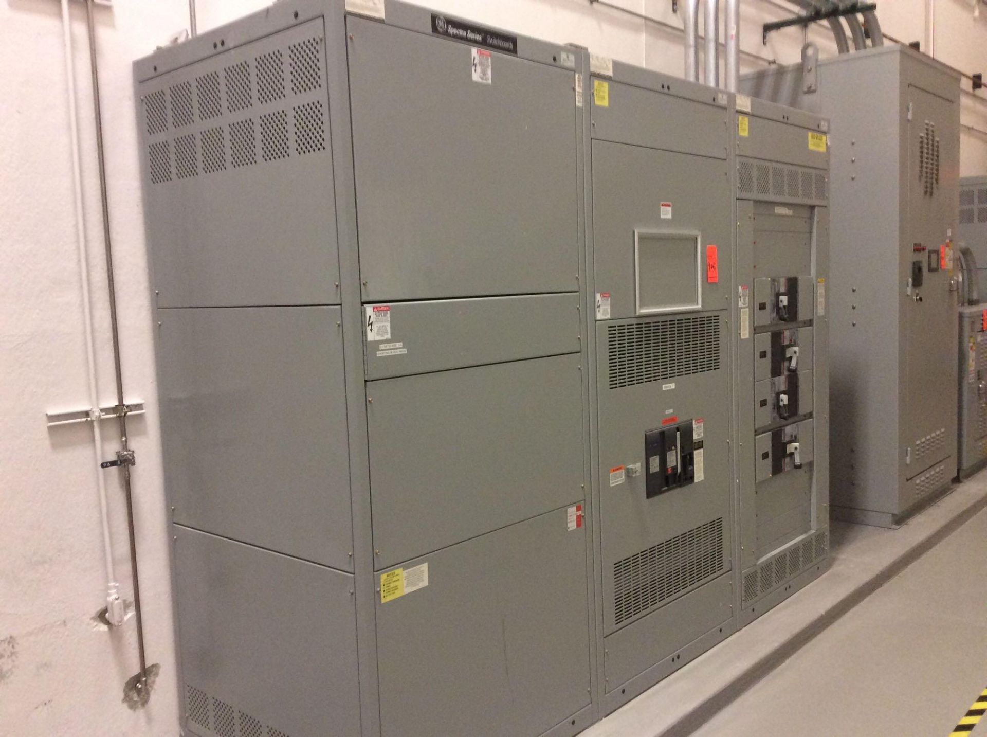 GE Spectra Series switchboard, 3 panel with (1) draw out and (4) breakers (LOCATED IN BATAVIA)