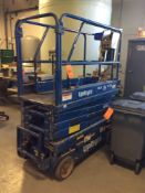 Upright electric scissor lift, mn MX-19, 286 hrs, 60" x 28" work deck with extension and built in ch