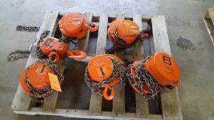 Lot of five assorted manual chain hoists, one 5 ton capacity, and four 1 ton capacity.