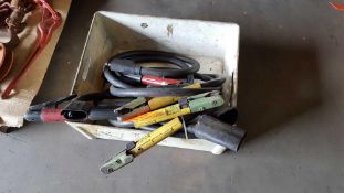 Lot of five assorted welding cables with clamps.