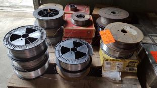 Lot of assorted spools of welding wire, 24 full and partial spools.