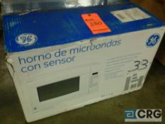 GE 1.4 cu ft 1100-watt microwave oven - new