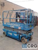 Genie electric scissor lift, man GS-2032, built in charger, 28" x 68" platform, 20' lift, solid