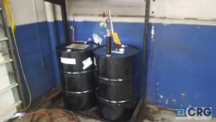 Lot of assorted drums of automotive solvents, oils, etc, with pumps. Buyer must take all drums and