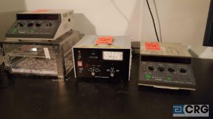 Lot of three assorted devices, including one Opti-Quip model 1500 power supply, and two Olympus