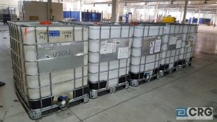 Lot of five poly storage tanks with metal support cage, top fill port and bottom faucets, 1650 kg