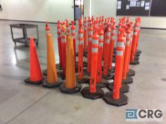 Lot of 22 assorted orange safety pylons.