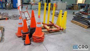 Lot contains one forklift barrel lifting attachment, four safety yellow barrier posts, one 4 wheel