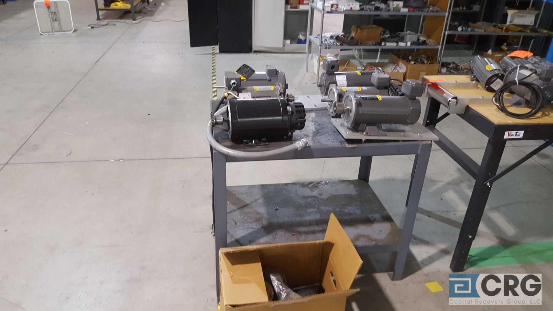 Lot of 7 assorted electric motors, with bench.