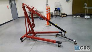 (1) two ton portable hydraulic engine hoist with lifting bar.