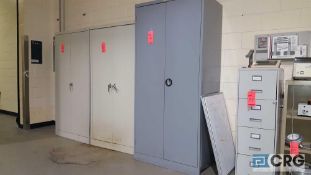 Lot of (3) assorted metal storage cabinets and one file cabinet.