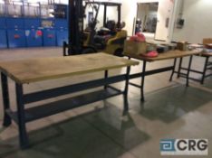 Lot of four assorted wood top, metal frame work benches.