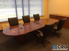 Contents of the conference room including 1) 12 ft oval Cherry type finish conference table, with