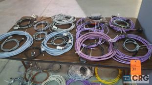 Lot of 35 +/- assorted cables, table excluded