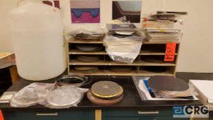 Lot of assorted sanding disks, parts and accessories, etc., contents of cabinet, no cabinet.