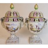 A pair of 18th century style Continental pottery pot pourri vases and covers,