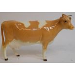 A Beswick Guernsey Cow, 1st version, 1248A, probable restoration to ears and horns,