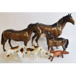 A Beswick Huntsman's Horse, brown, 1484, a Pony, head up, brown, 1197, a Swish-Tail Horse,