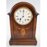 An Edwardian mantel clock, the white dial with Roman numerals, fitted a movement striking on a gong,