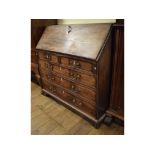 A 19th century mahogany bureau, with swan neck handles,