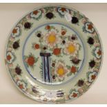 A Dutch polychrome plate, with floral decoration, some fritting, 34.
