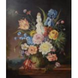 Continental school, a still life of flowers in a glass vase, oil on board, indistinctly signed,