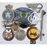 Assorted car badge insignia and badge bar badges, including a Bentley black label radiator badge,