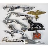 A set of three graduated leaping Jaguar car mascots, a leaping gazelle car mascot,