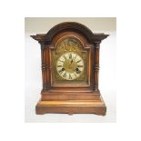 A Victorian mahogany mantel clock, the 11 cm brass dial with Roman numerals,