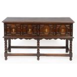 An oak dresser base, the two frieze drawers with moulded decoration,