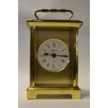 A brass carriage clock, modern,