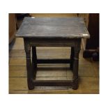 A late 17th/early 18th century small oak table, on turned legs, joined by stretchers,