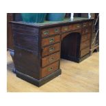 A mahogany campaign style pedestal desk,