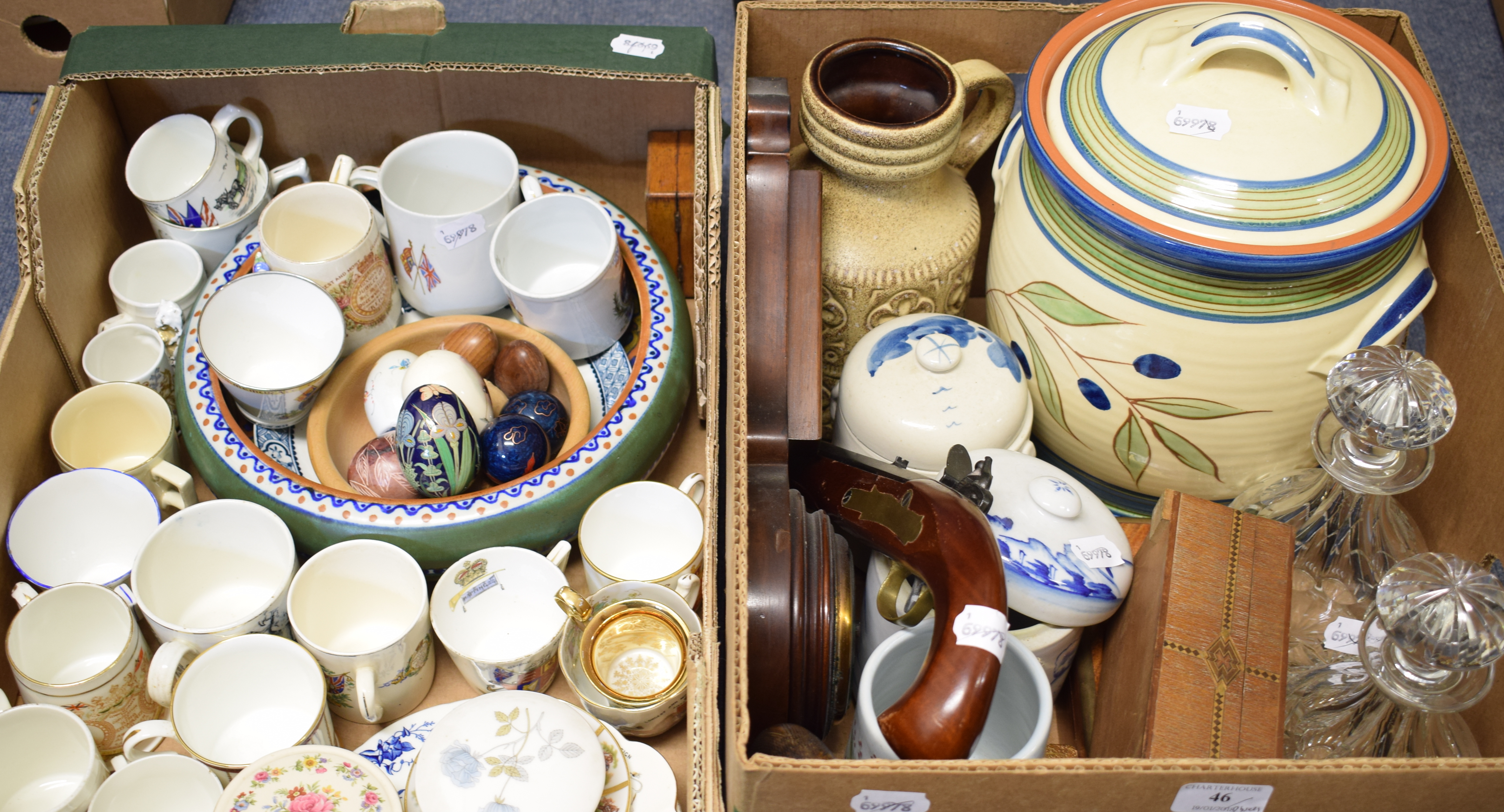 A Gouda pottery bowl, assorted commemorative mugs, an inlaid mahogany barometer/thermometer,