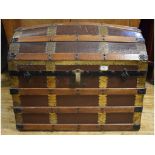 An oak and metal bound dome top travelling trunk,