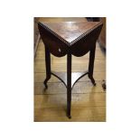 A late Victorian rosewood triangular drop leaf table, inlaid scrolling acanthus leaves,