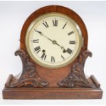 A mantel clock, the 20 cm diameter dial with Roman numerals, in a walnut case, 39.