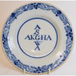 A Dutch Delft plate, inscribed ASGWA/AKGHA, within a floral border, slight fritting,