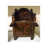 A Tibetan painted wood scripture table, having a galleried section above two sliding doors,