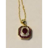 An Art Deco style 9ct gold, ruby and diamond pendant,
