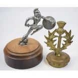 An accessory car mascot, in the form of a gladiator holding a shield, chrome plated,