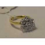 A 9ct gold and diamond flowerhead ring, approx.