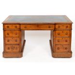 A late Victorian oak pedestal desk, with a breakfront central section,