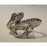 A silver bangle, in the form of a snake, set rubies,