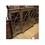 An early 20th century breakfront bookcase,