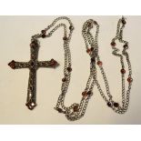 A large silver and garnet cross,