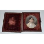 An oval bust portrait miniature, of a lady, watercolour, 5 x 4 cm,